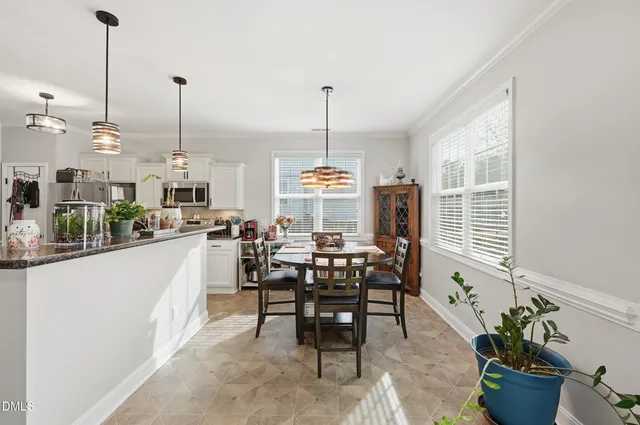 a view of a dining room with furniture window and outside view