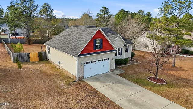 an aerial view of a house with yard