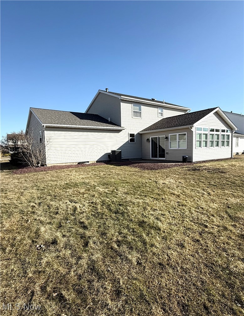 5115 Raspberry Lane Mineral Ridge, OH 44440 - Photo 2 of 25 Rear view of house featuring a yard