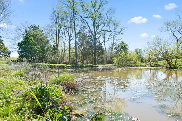 an aerial view of a houses with outdoor space