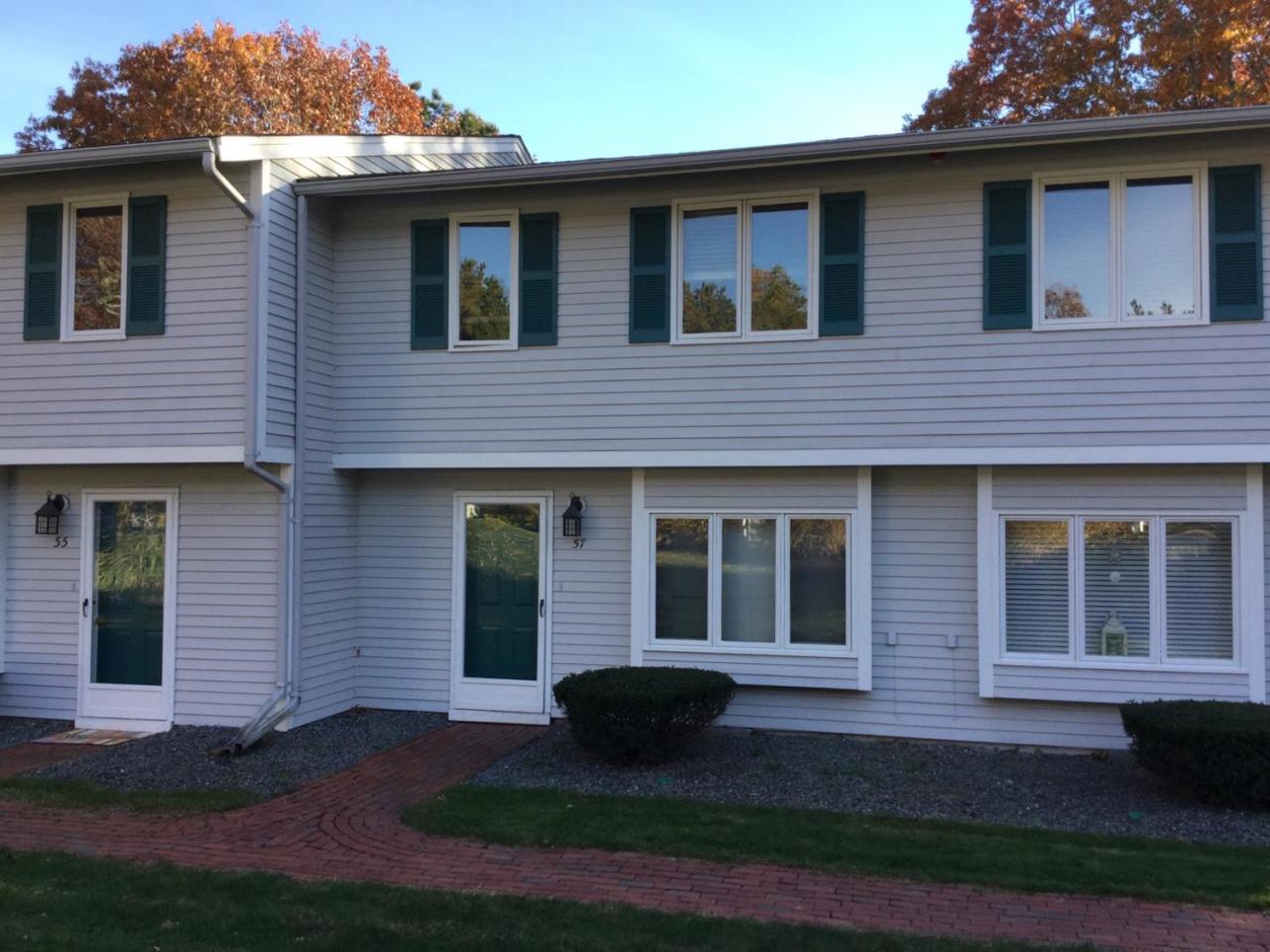 174 Lowell Road, Unit 57 Mashpee, MA 02649 - Photo 2 of 12 a black and white house with outdoor space