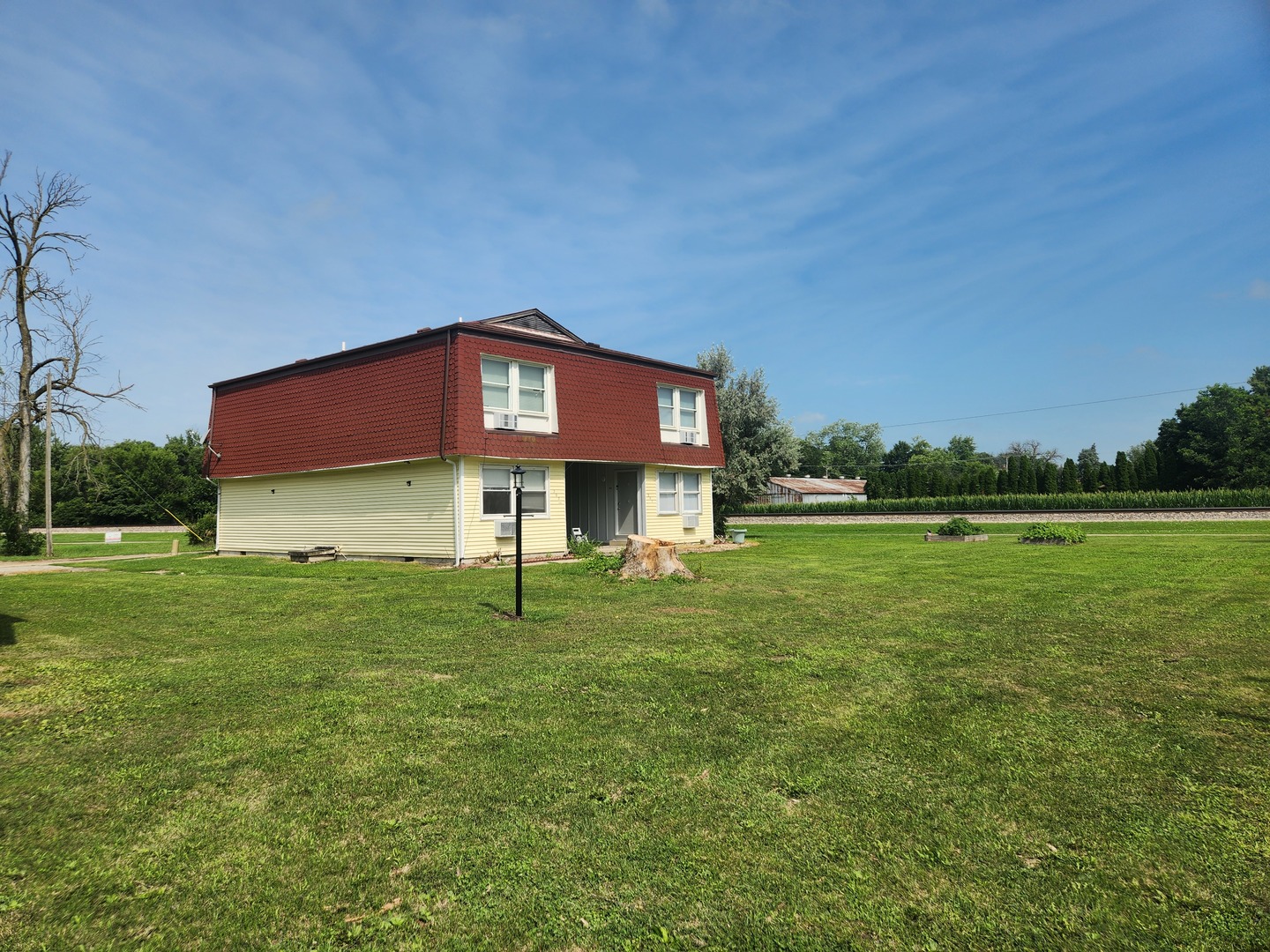 201-203 South Maple Street Toluca, IL 61369 - Photo 3 of 11 a view of a house with a yard
