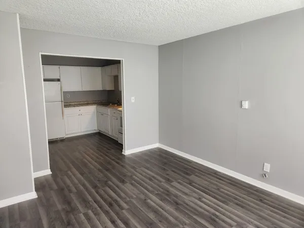 a room with wooden floors and closet