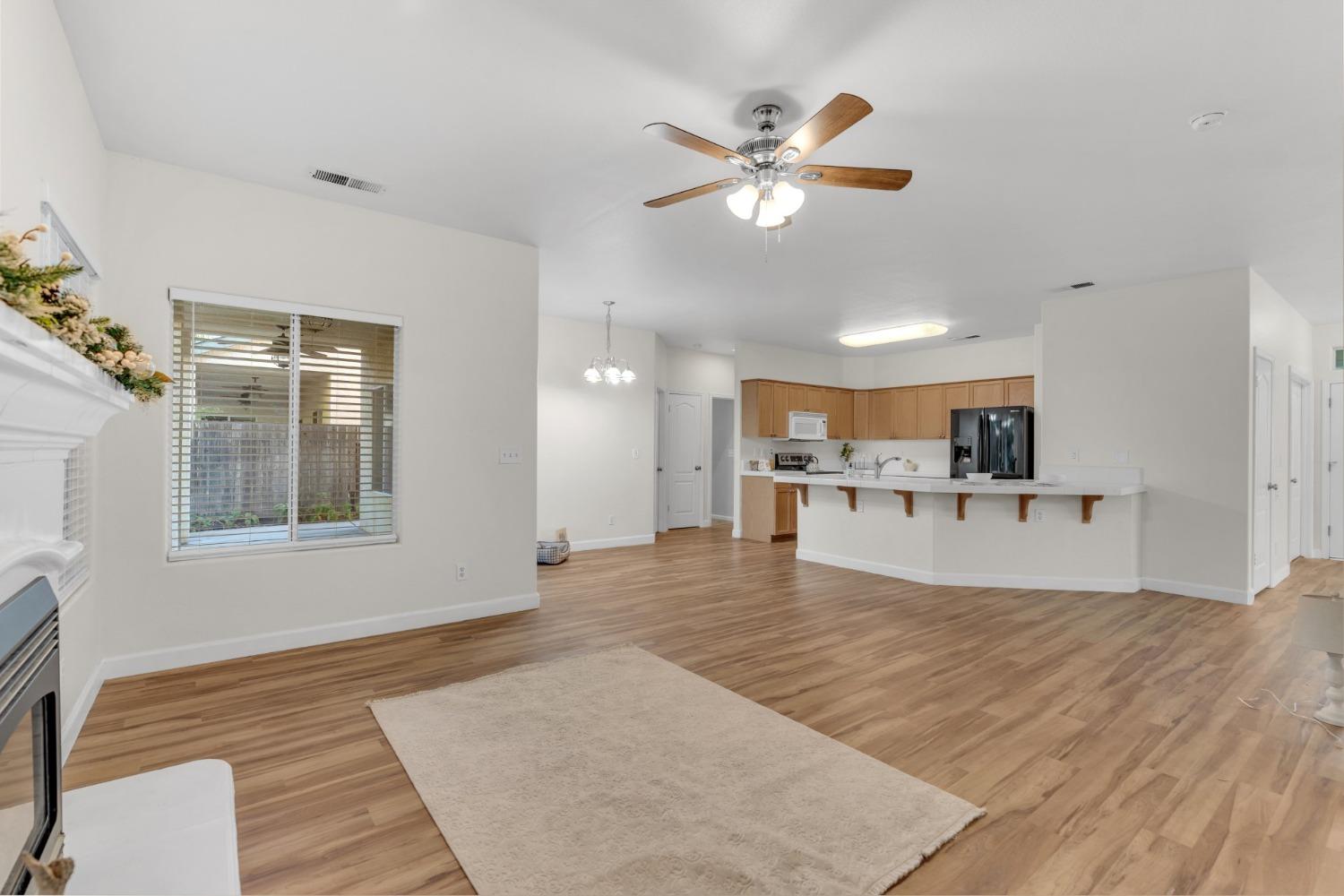 2573 Applegate Avenue Clovis, CA 93611 - Photo 7 of 26 a view of a livingroom with kitchen and furniture