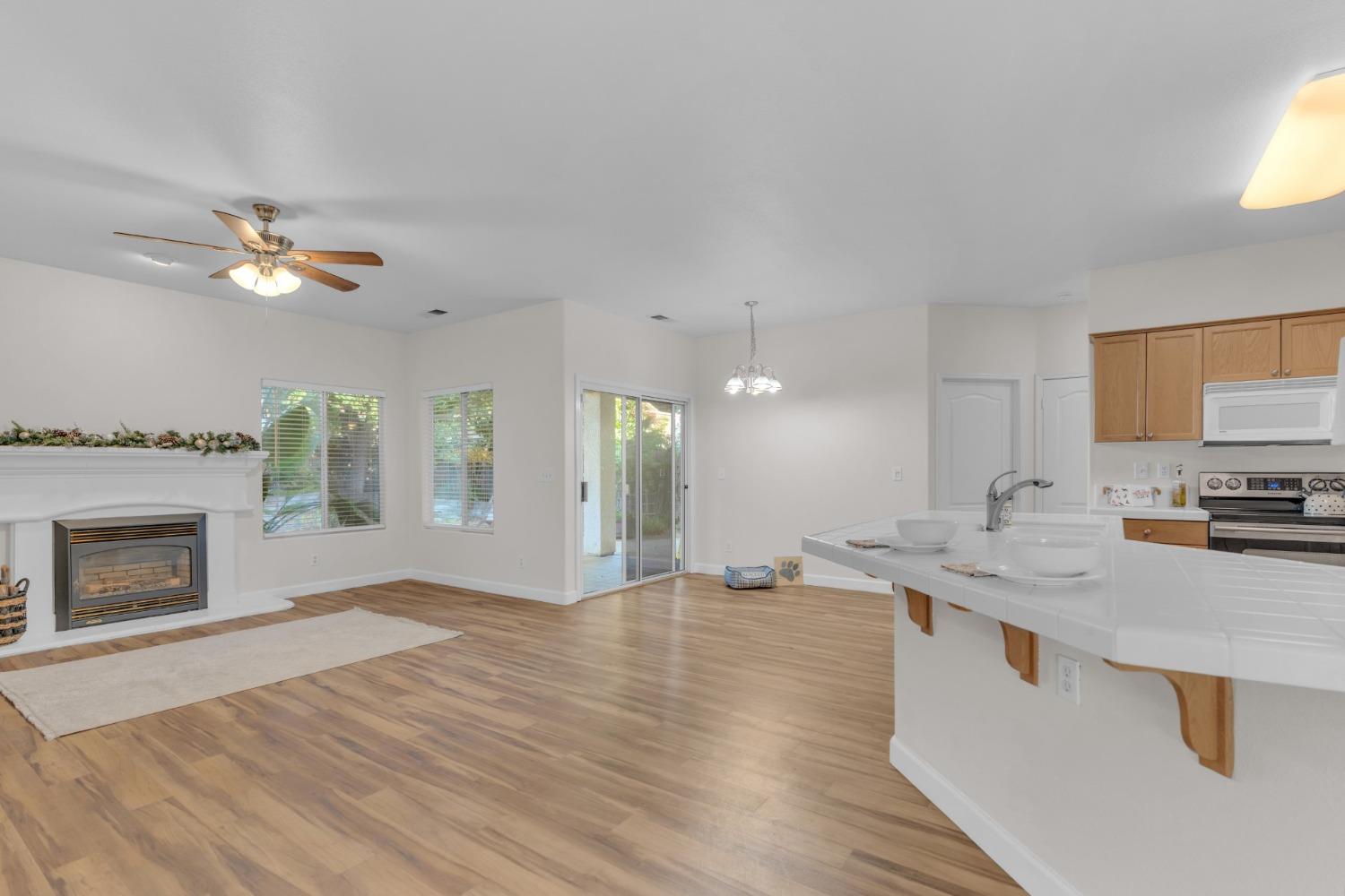 2573 Applegate Avenue Clovis, CA 93611 - Photo 8 of 26 a open kitchen with a sink and a fireplace