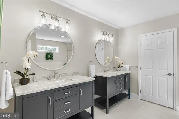 a bathroom with a bathtub and shower