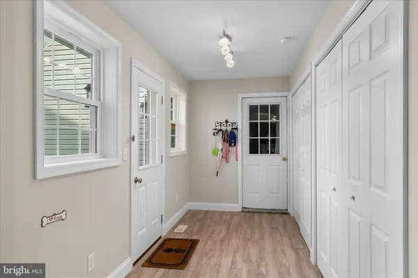 a view of dining room with furniture and wooden floor