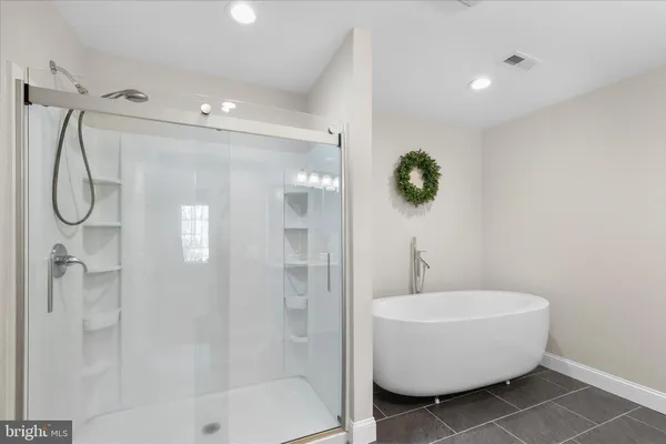 a bathroom with a double vanity sink mirror and toilet