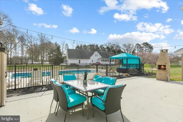 a view of backyard of house with seating space