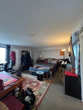 a living room with lots of furniture and a flat screen tv