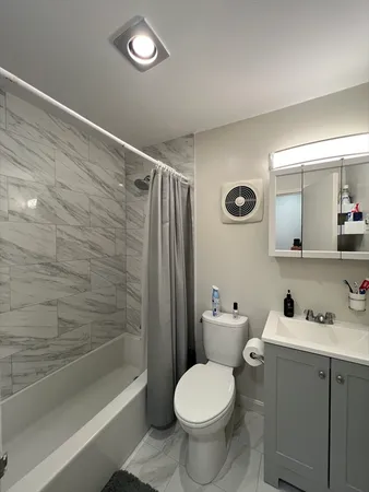 a bathroom with a toilet a sink and bathtub