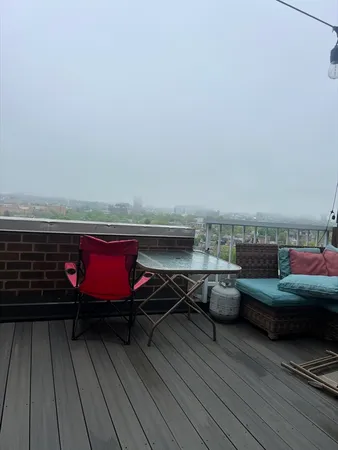 a view of roof deck with seating space
