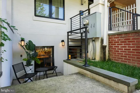 a view of balcony with furniture