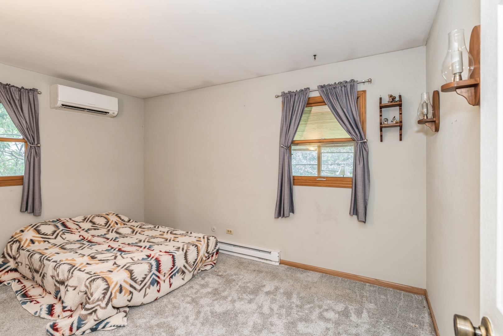 3308 Stieg Road Woodstock, IL 60098 - Photo 11 of 27 a bedroom with a bed and a window