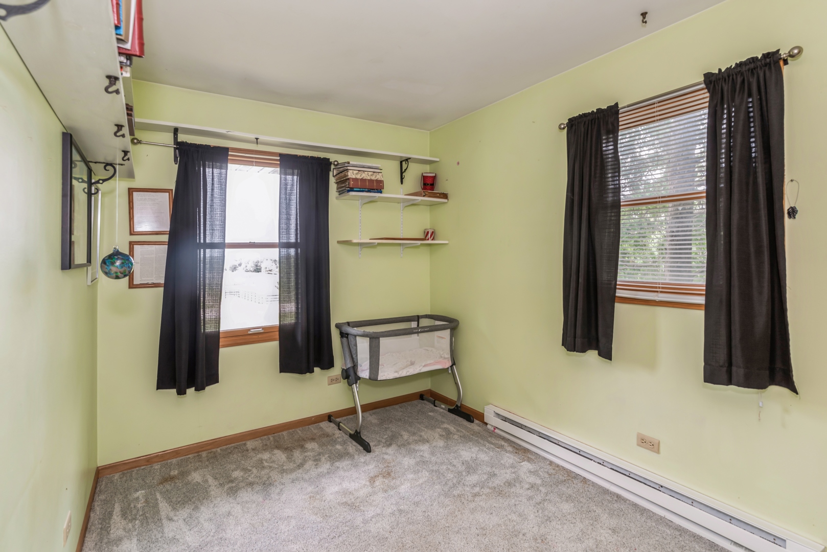3308 Stieg Road Woodstock, IL 60098 - Photo 12 of 27 a room with a door open to a couch