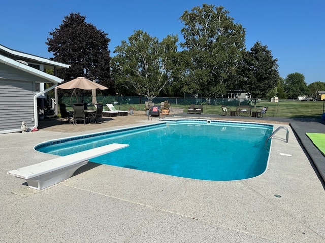 3308 Stieg Road Woodstock, IL 60098 - Photo 18 of 27 a view of a swimming pool with lounge chair