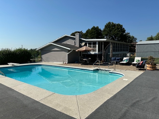 3308 Stieg Road Woodstock, IL 60098 - Photo 19 of 27 a view of a swimming pool with a patio