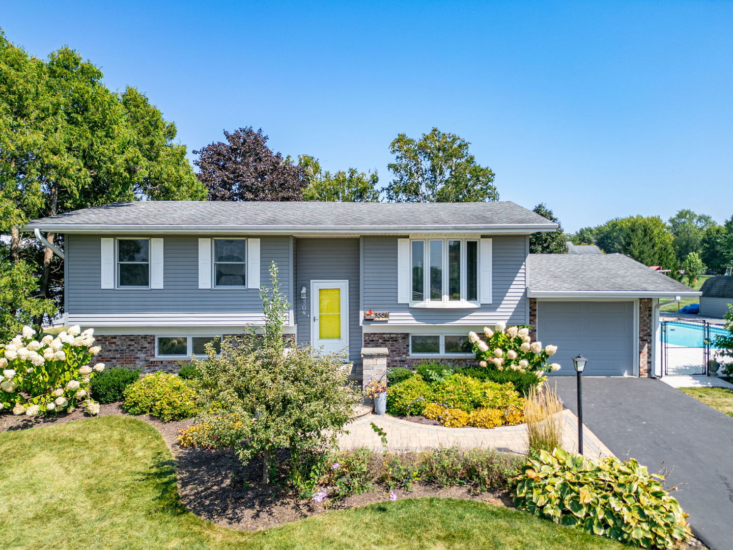 3308 Stieg Road Woodstock, IL 60098 - Photo 2 of 27 a front view of a house with a yard