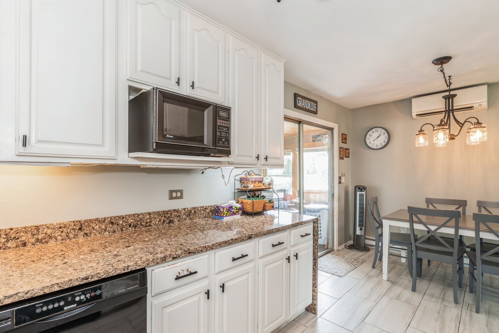 3308 Stieg Road Woodstock, IL 60098 - Photo 7 of 27 a kitchen with stainless steel appliances granite countertop a stove and cabinets