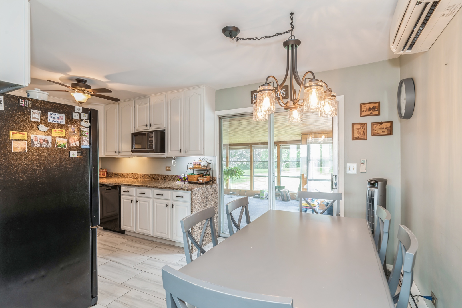 3308 Stieg Road Woodstock, IL 60098 - Photo 8 of 27 a kitchen with stainless steel appliances granite countertop a stove oven and a refrigerator with white cabinets