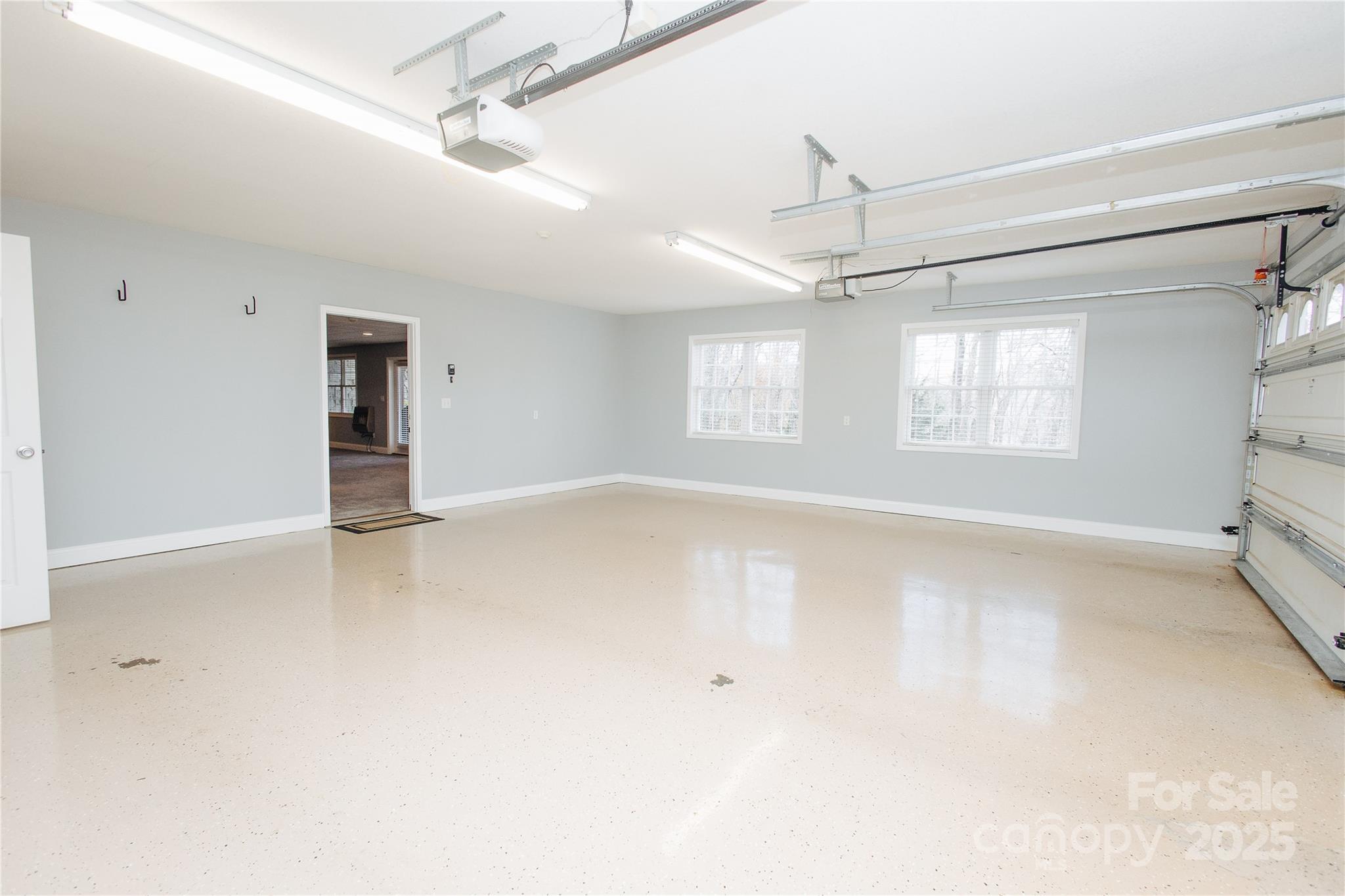 89 Bobcat Path Marion, NC 28752 - Photo 13 of 48 an empty room with windows and ceiling fan