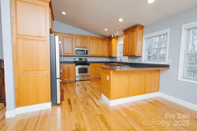 a view of balcony with wooden floor and fence