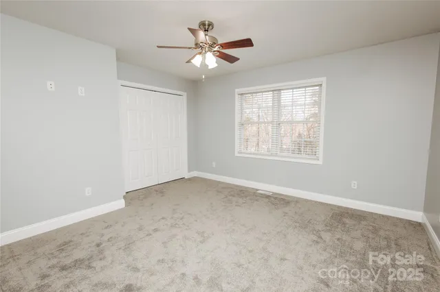 a bathroom with a sink a toilet and vanity