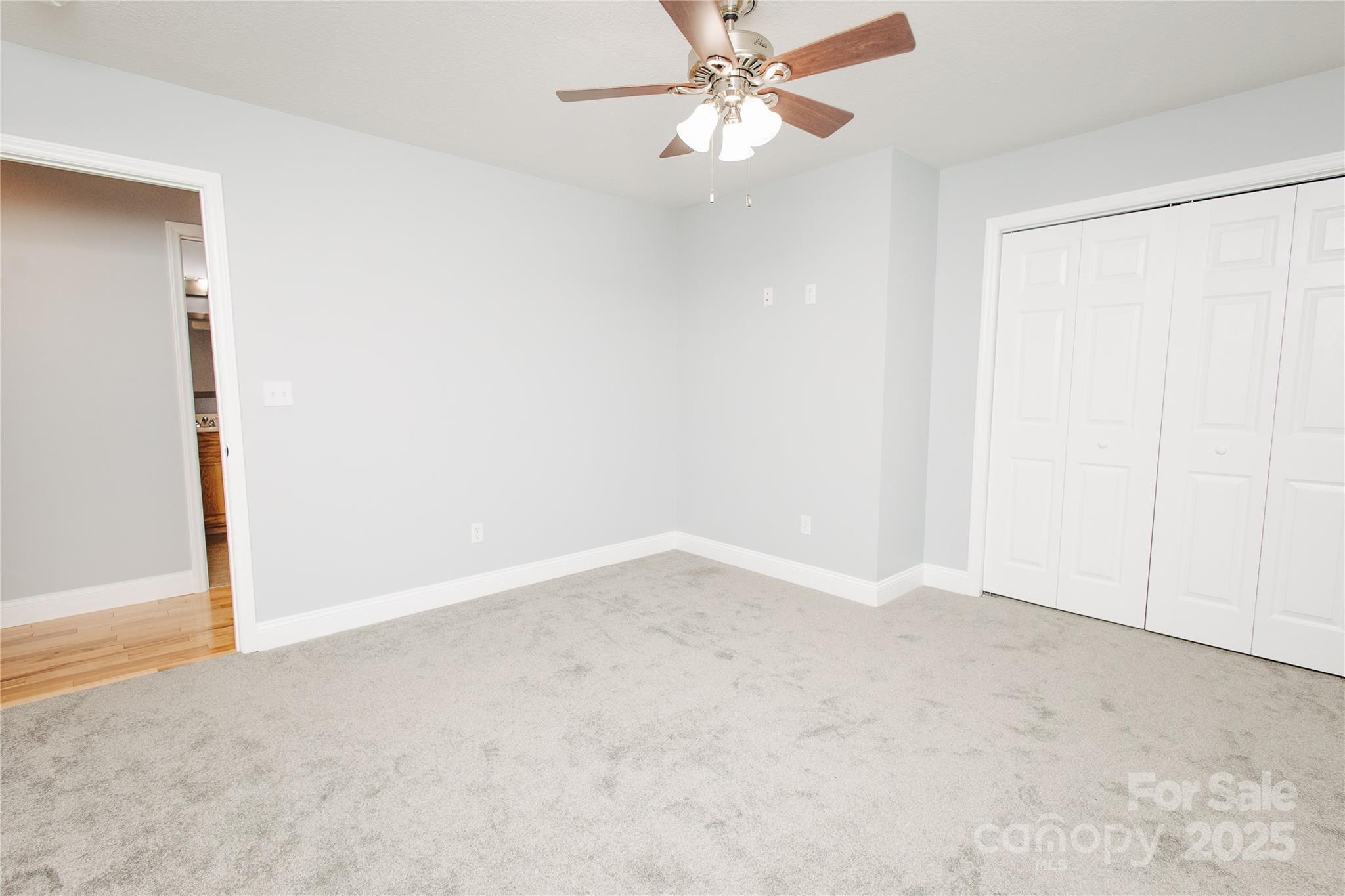 89 Bobcat Path Marion, NC 28752 - Photo 26 of 48 an empty room with a chandelier fan