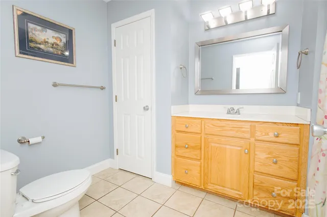 a view of a microwave and cabinets