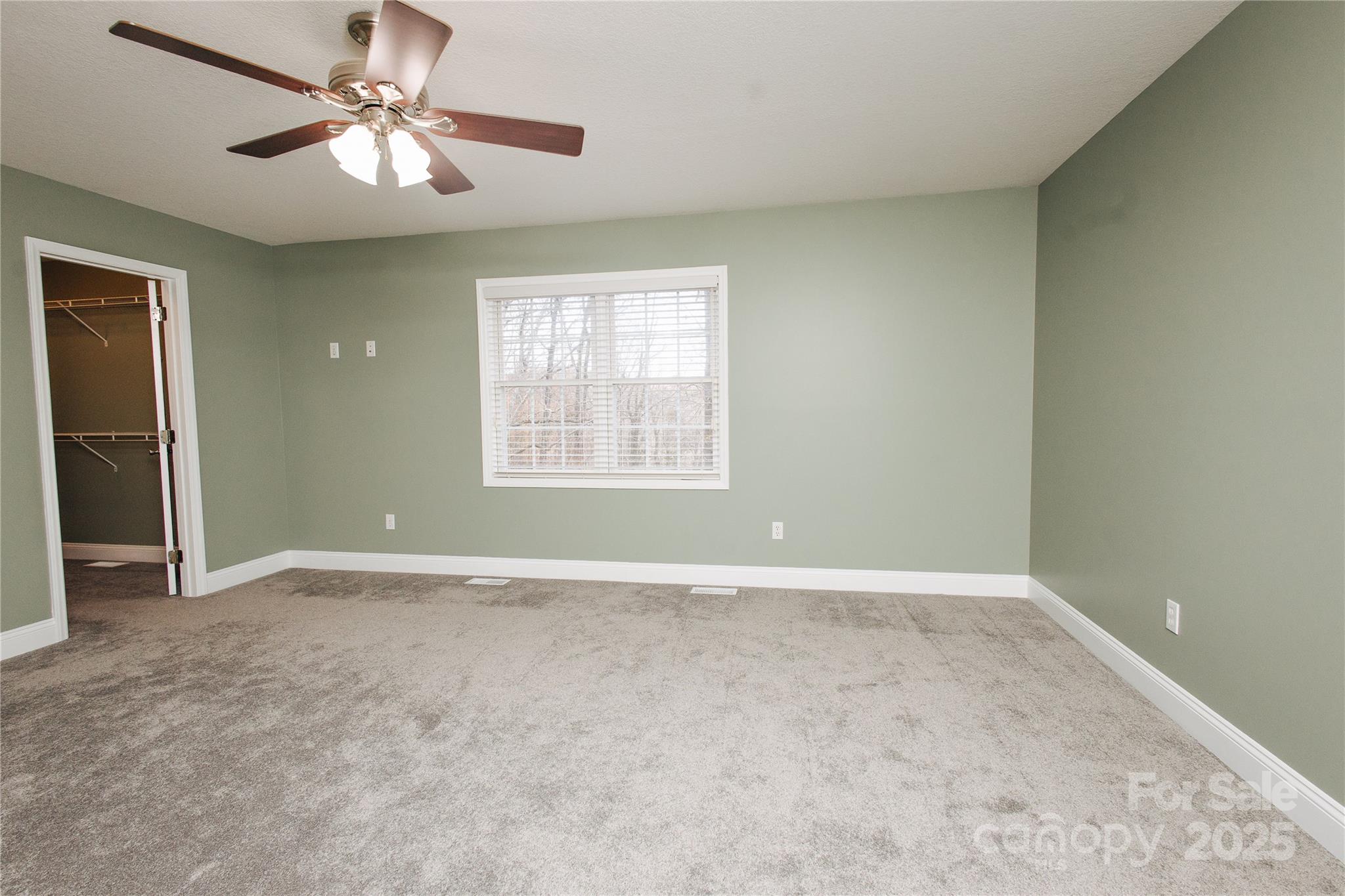 89 Bobcat Path Marion, NC 28752 - Photo 31 of 48 an empty room with windows and fan