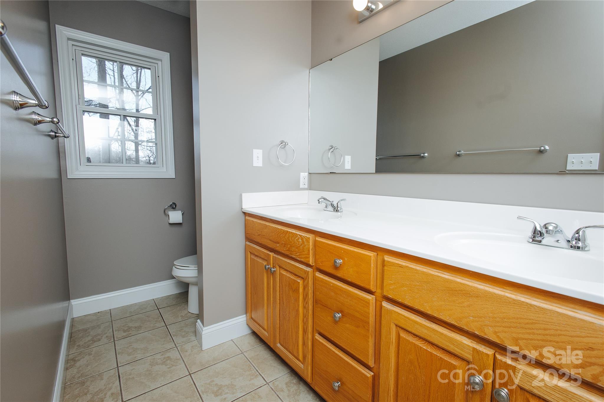89 Bobcat Path Marion, NC 28752 - Photo 32 of 48 a spacious bathroom with a sink a toilet and a mirror