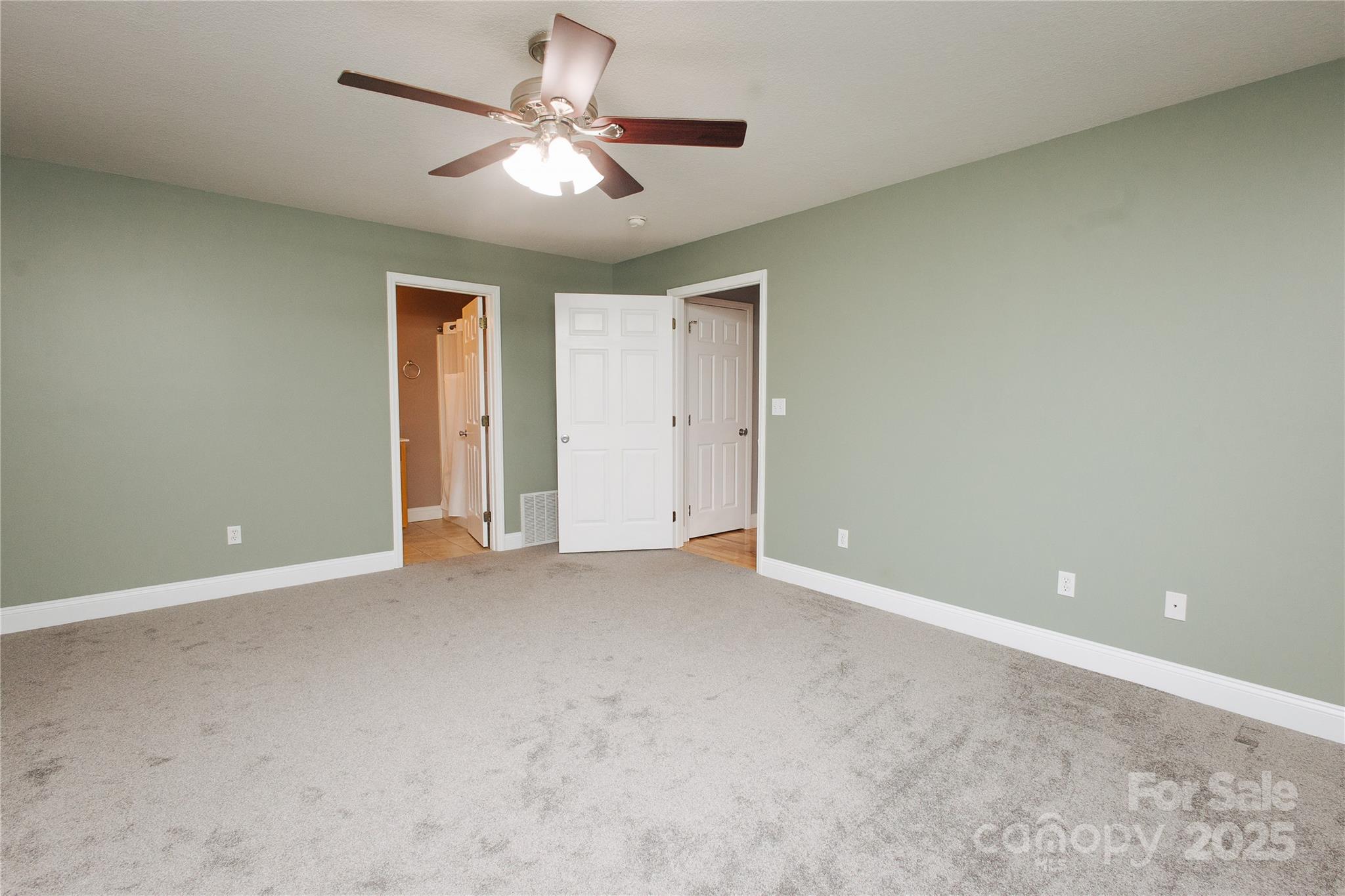 89 Bobcat Path Marion, NC 28752 - Photo 37 of 48 an empty room with a ceiling fan and a window
