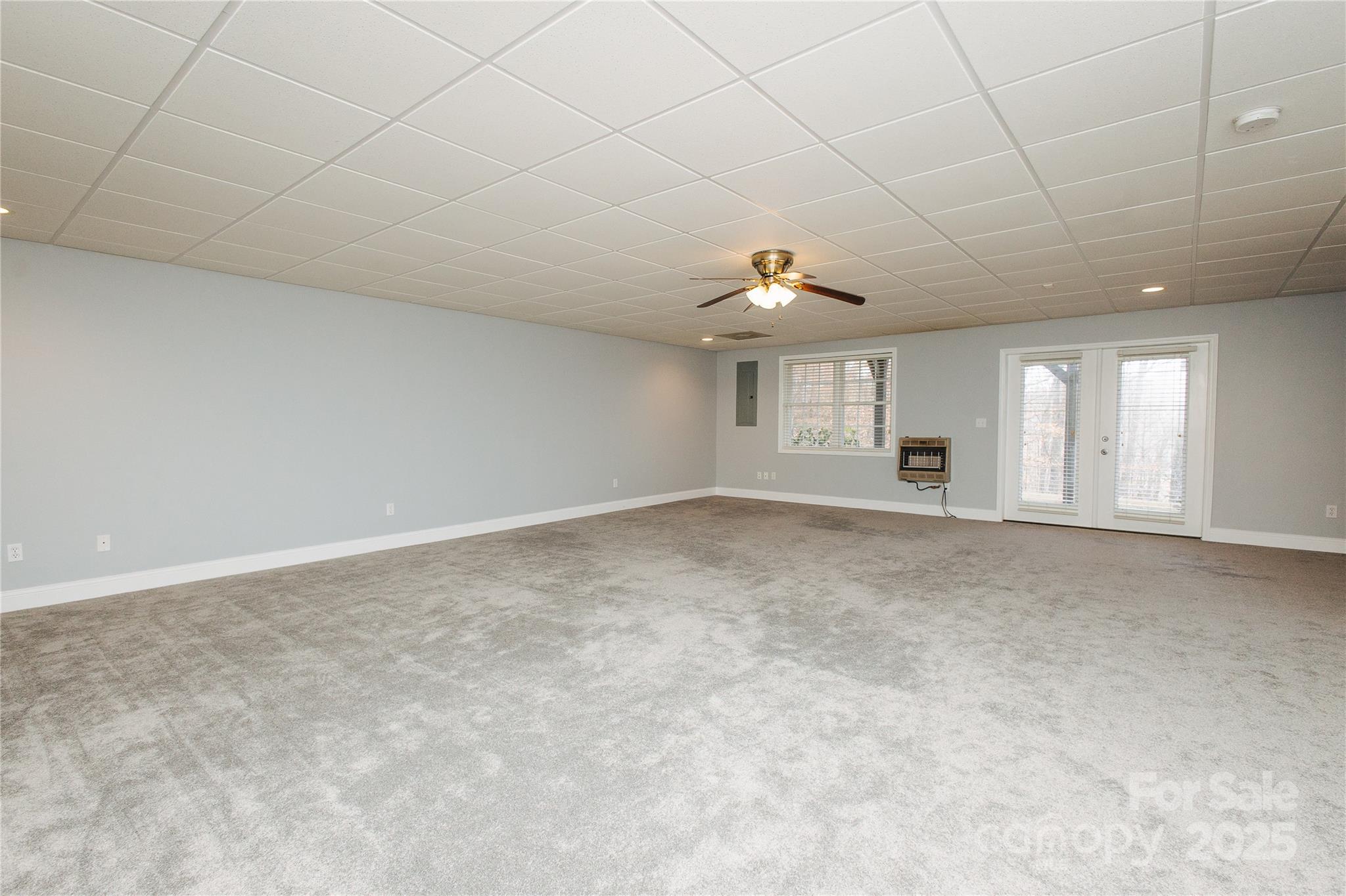 89 Bobcat Path Marion, NC 28752 - Photo 7 of 48 an empty room with windows and pillars in it
