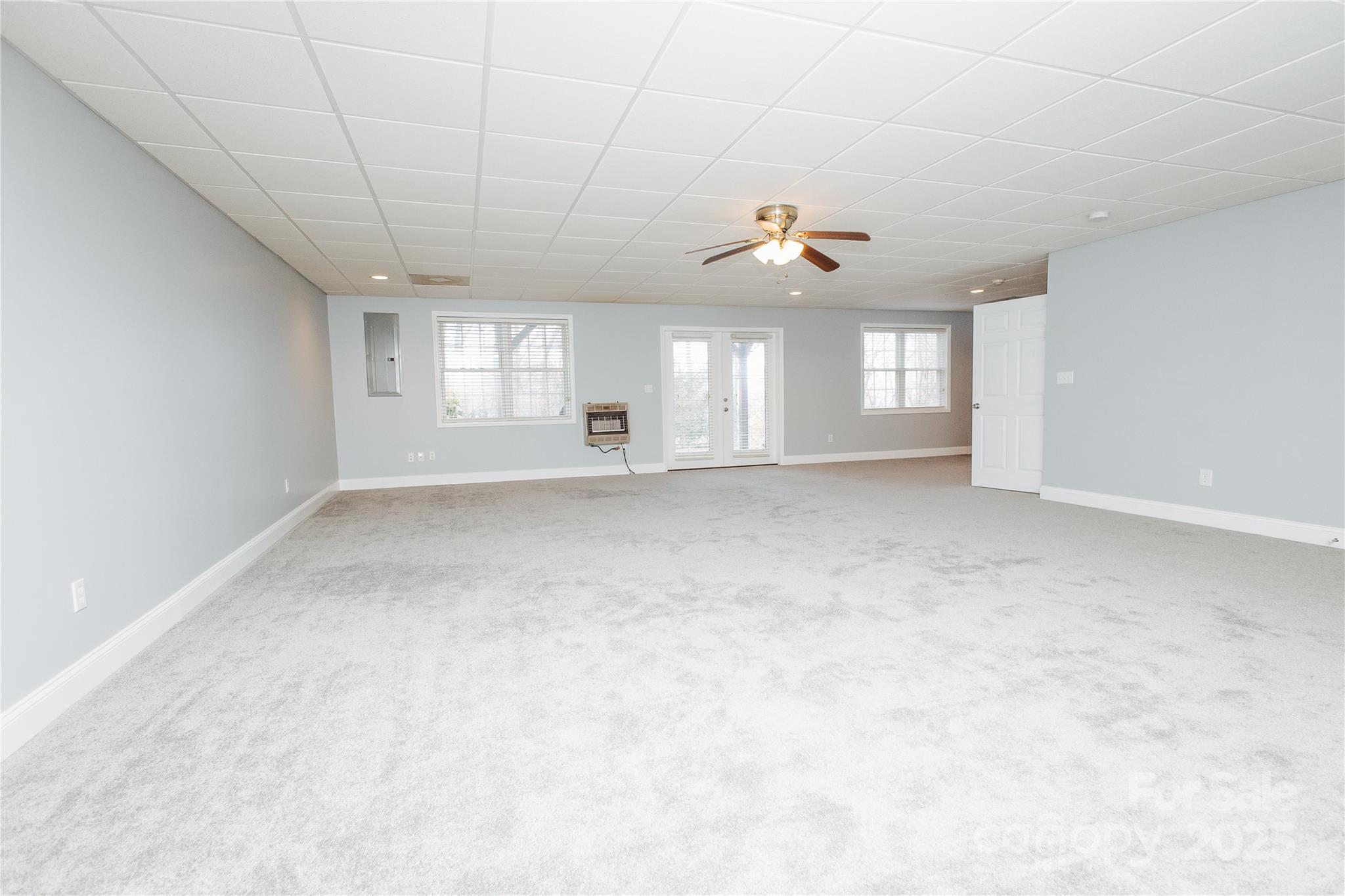 89 Bobcat Path Marion, NC 28752 - Photo 9 of 48 a view of a livingroom with a ceiling fan and window