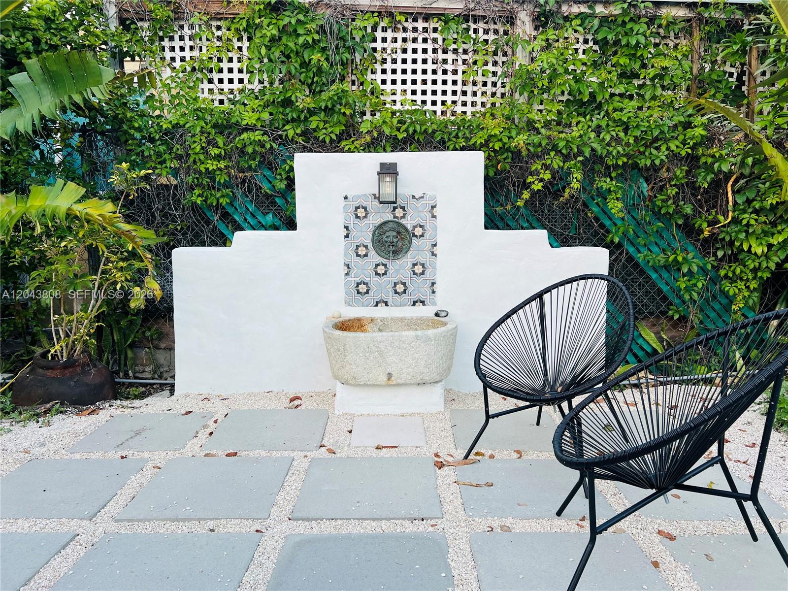 2134 Southwest 11th Street Miami, FL 33135 - Photo 3 of 13 a terrace of a house with outdoor seating