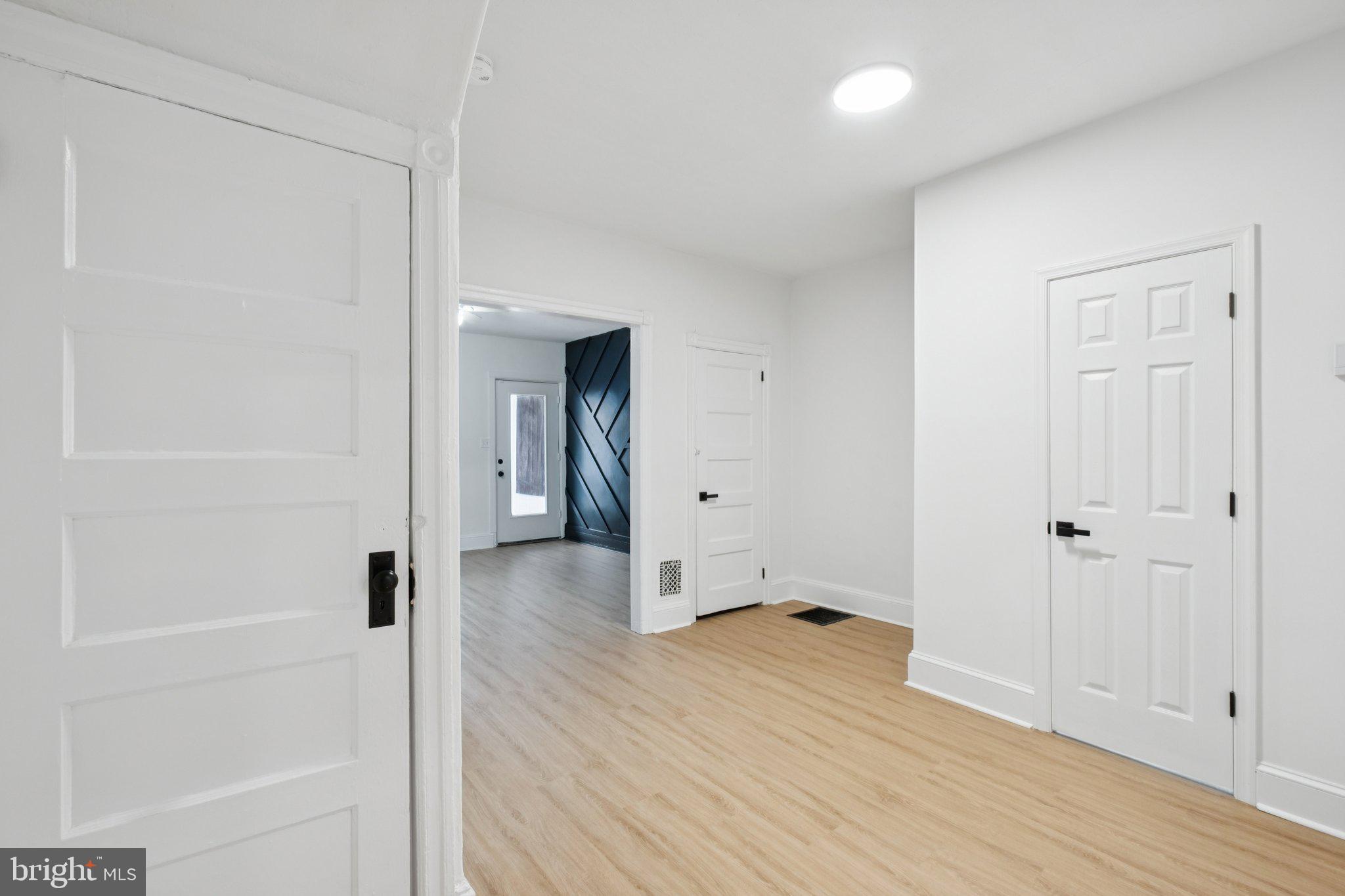 6638 Ross Street Philadelphia, PA 19119 - Photo 11 of 18 a view of a room with wooden floor and a bathroom