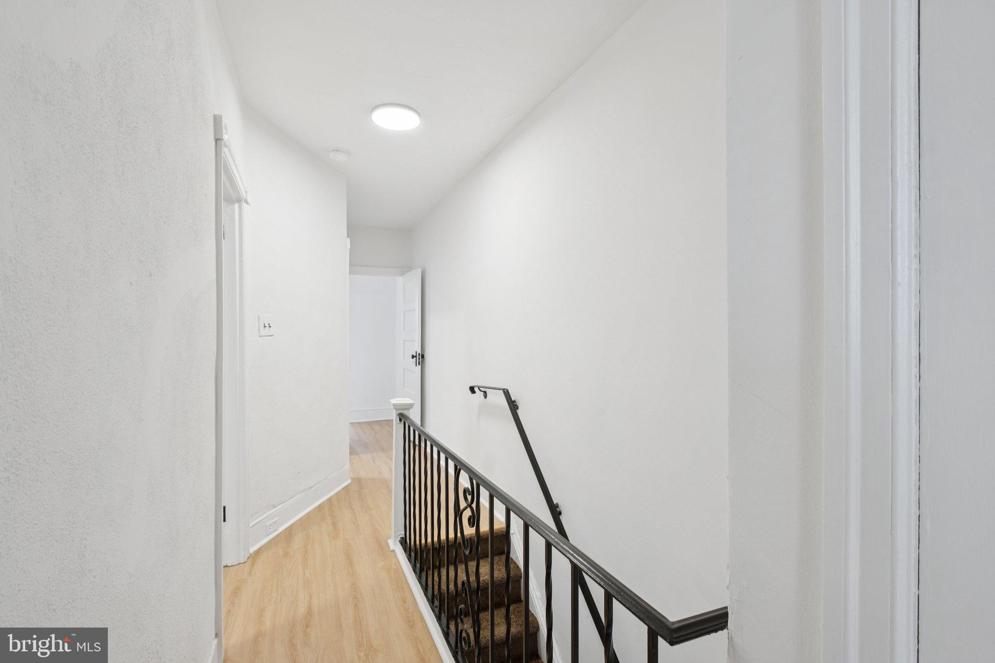 6638 Ross Street Philadelphia, PA 19119 - Photo 12 of 18 a view of a hallway with staircase