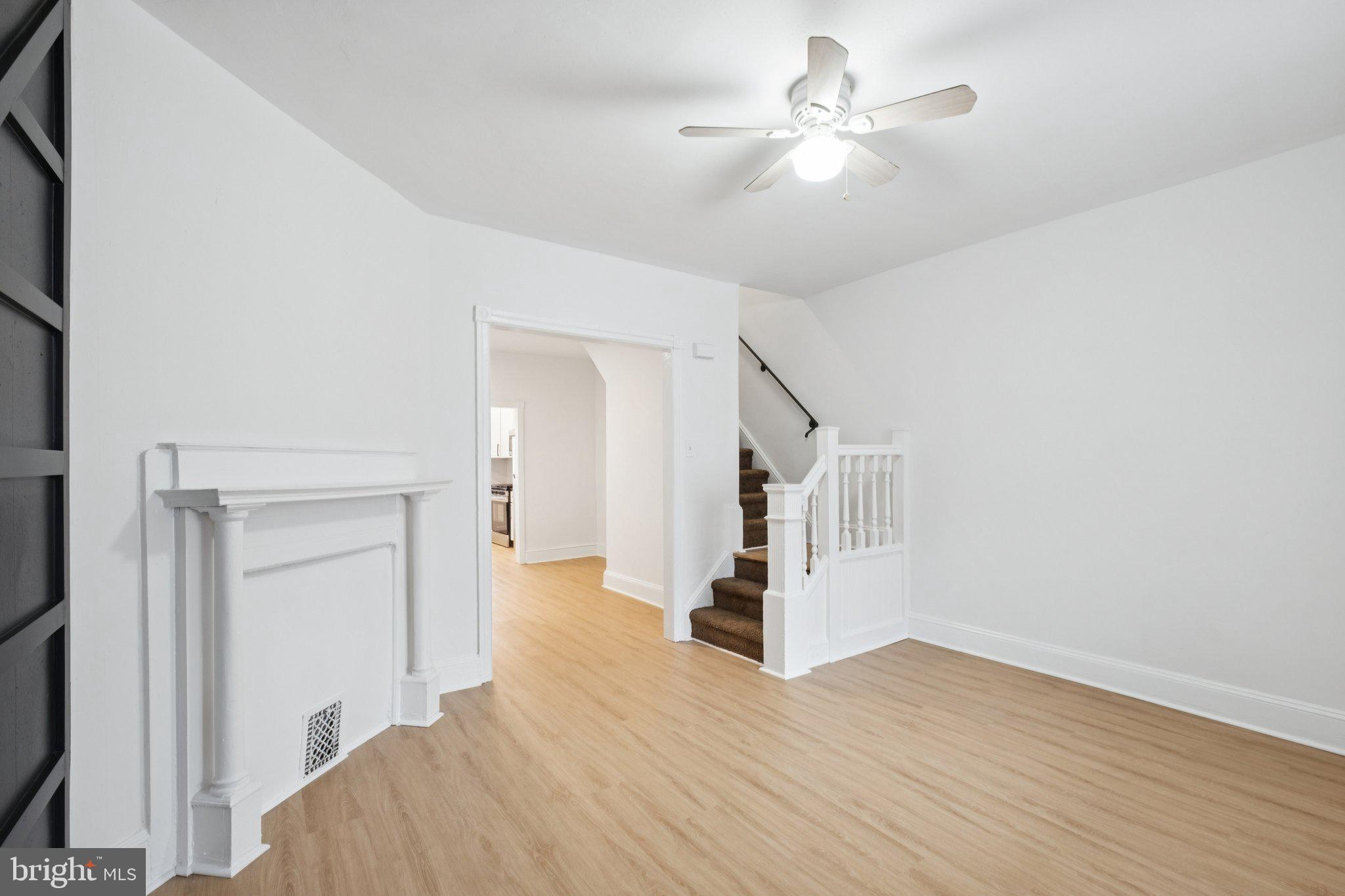 6638 Ross Street Philadelphia, PA 19119 - Photo 5 of 18 a view of a room with wooden floor and a ceiling fan
