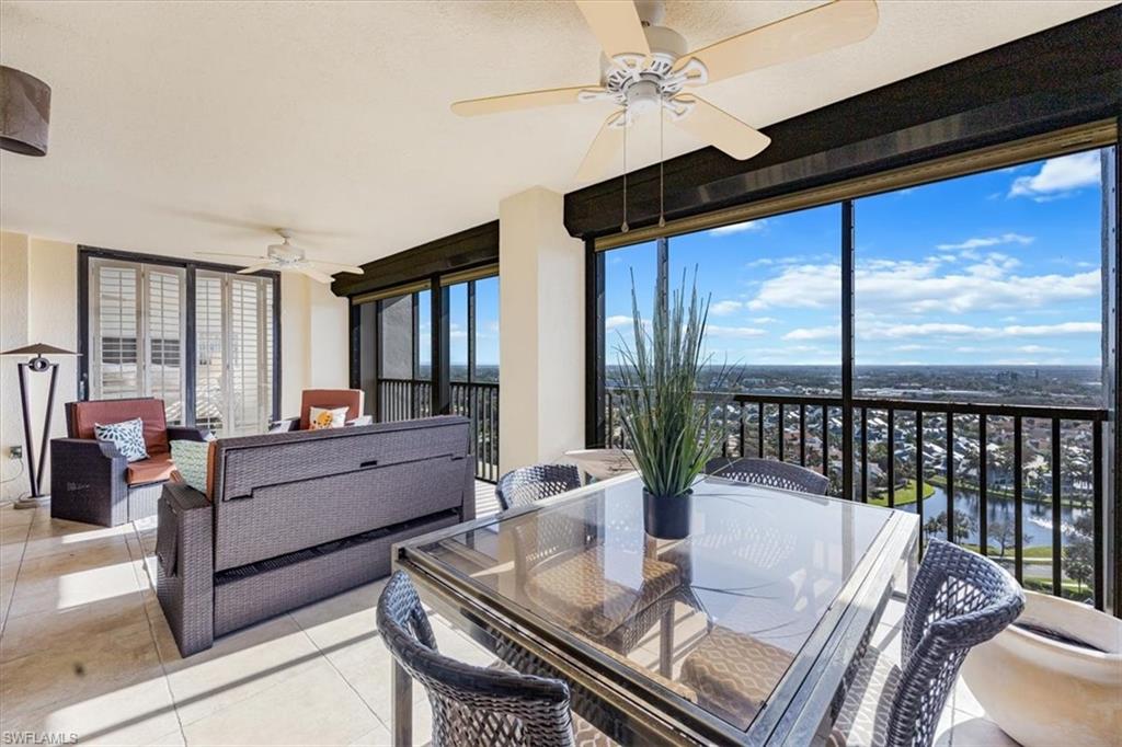 5601 Turtle Bay Drive, Unit 2003 Naples, FL 34108 - Photo 19 of 19 a living room with furniture and a large window