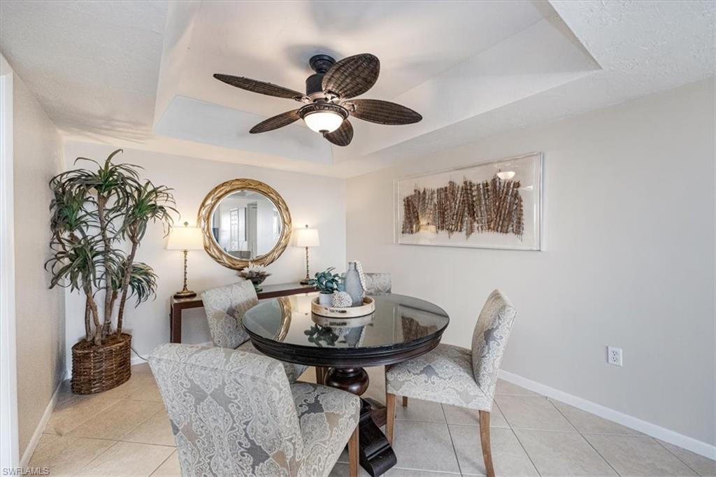 5601 Turtle Bay Drive, Unit 2003 Naples, FL 34108 - Photo 6 of 19 a living room with furniture and a potted plant