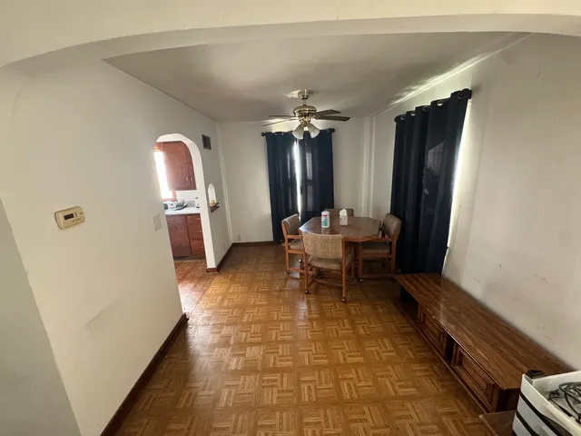 a bathroom with a sink mirror vanity and toilet