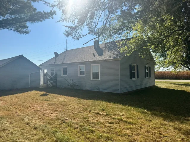 a view of a backyard of the house