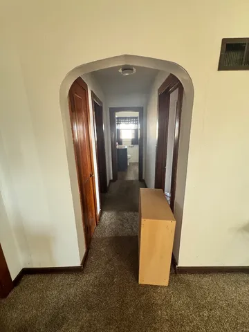 a view of a livingroom with furniture and a ceiling fan