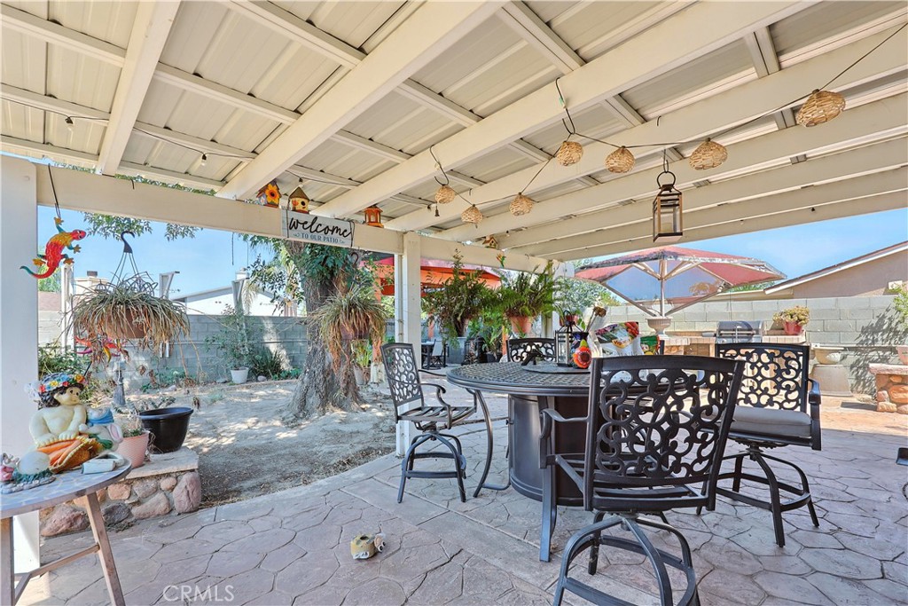769 Harding Street Hemet, CA 92543 - Photo 21 of 29 a view of a patio with a table and chairs