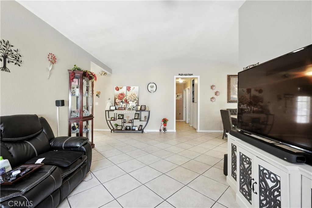 769 Harding Street Hemet, CA 92543 - Photo 7 of 29 a living room with furniture and a flat screen tv