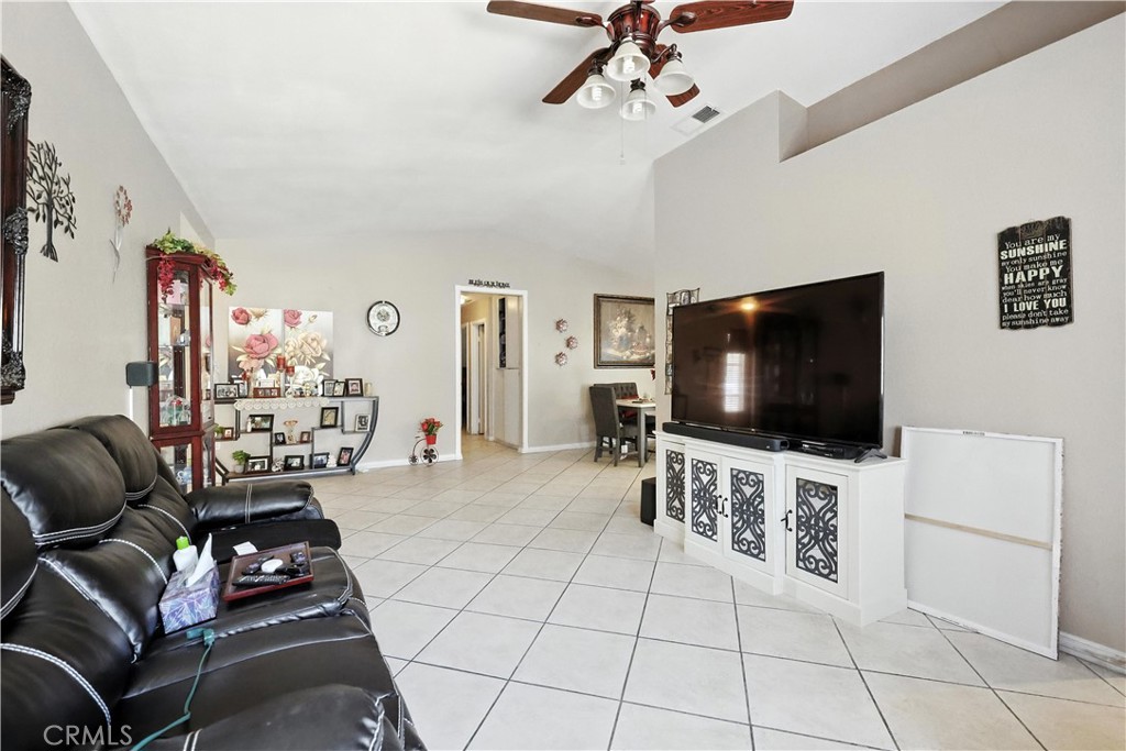 769 Harding Street Hemet, CA 92543 - Photo 8 of 29 a living room with furniture and a flat screen tv