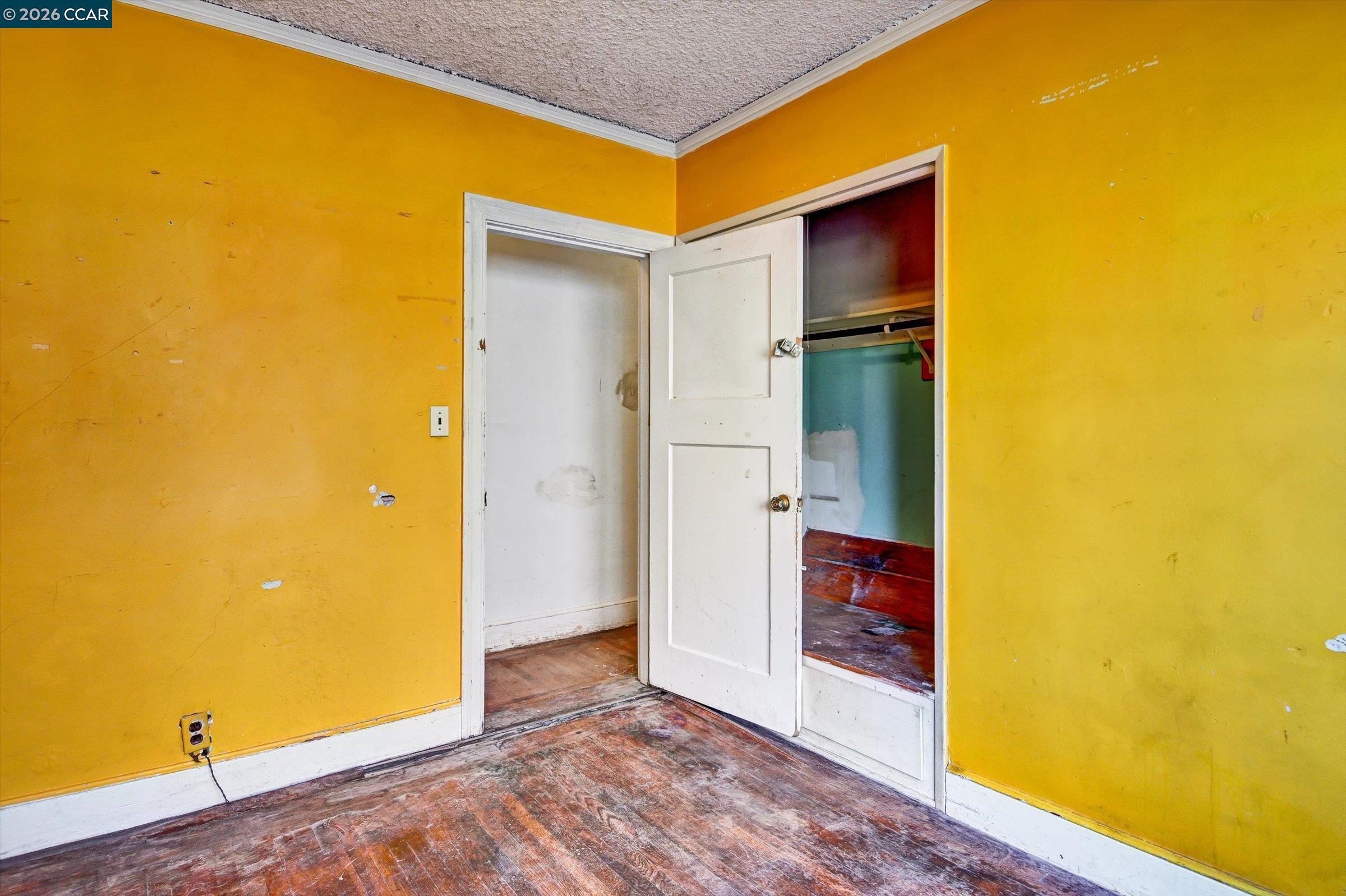 1711 Carleton Street Berkeley, CA 94703 - Photo 16 of 40 a view of an empty room with wooden floor and a bathroom