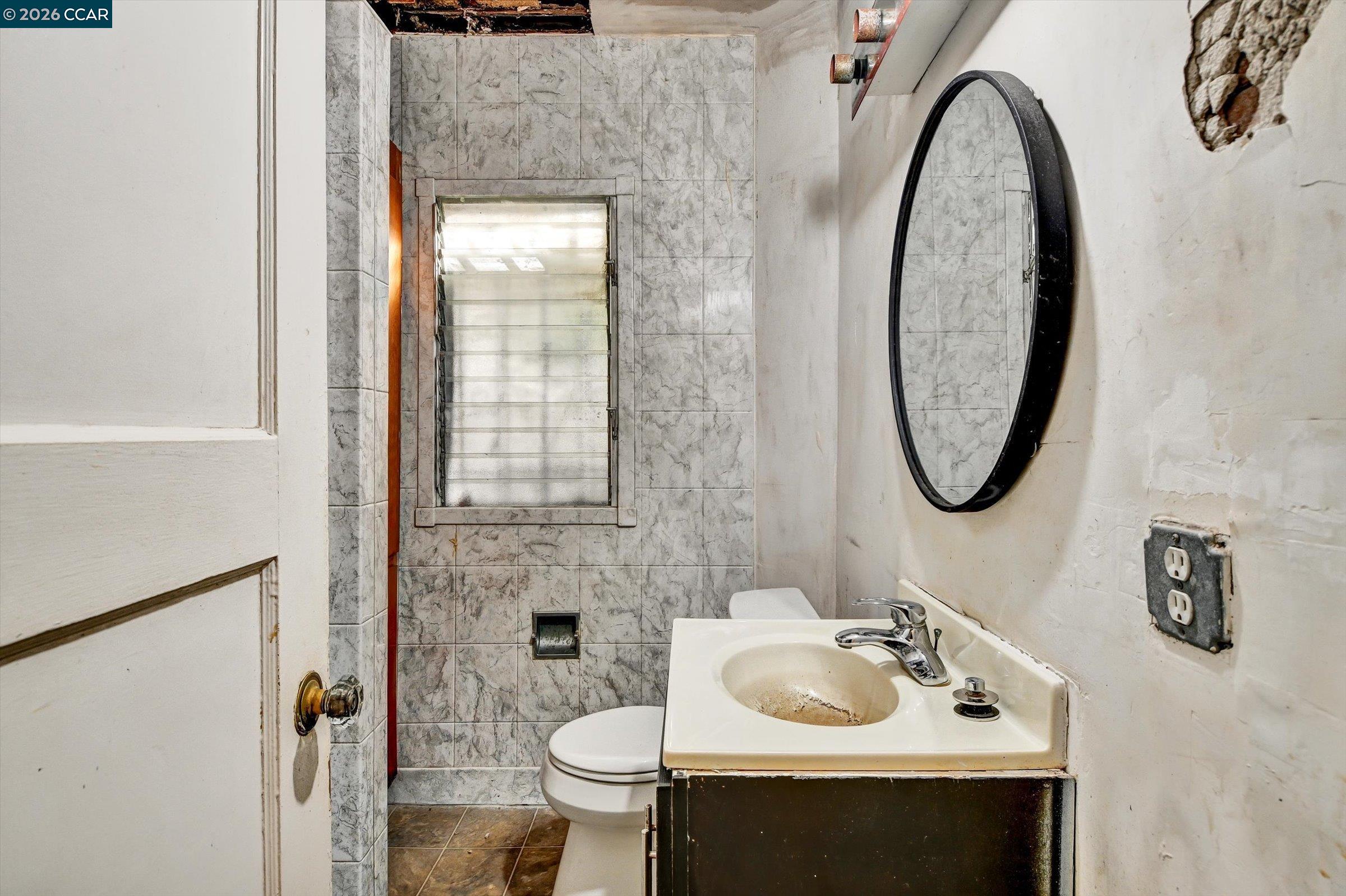 1711 Carleton Street Berkeley, CA 94703 - Photo 17 of 40 a bathroom with a sink and a mirror