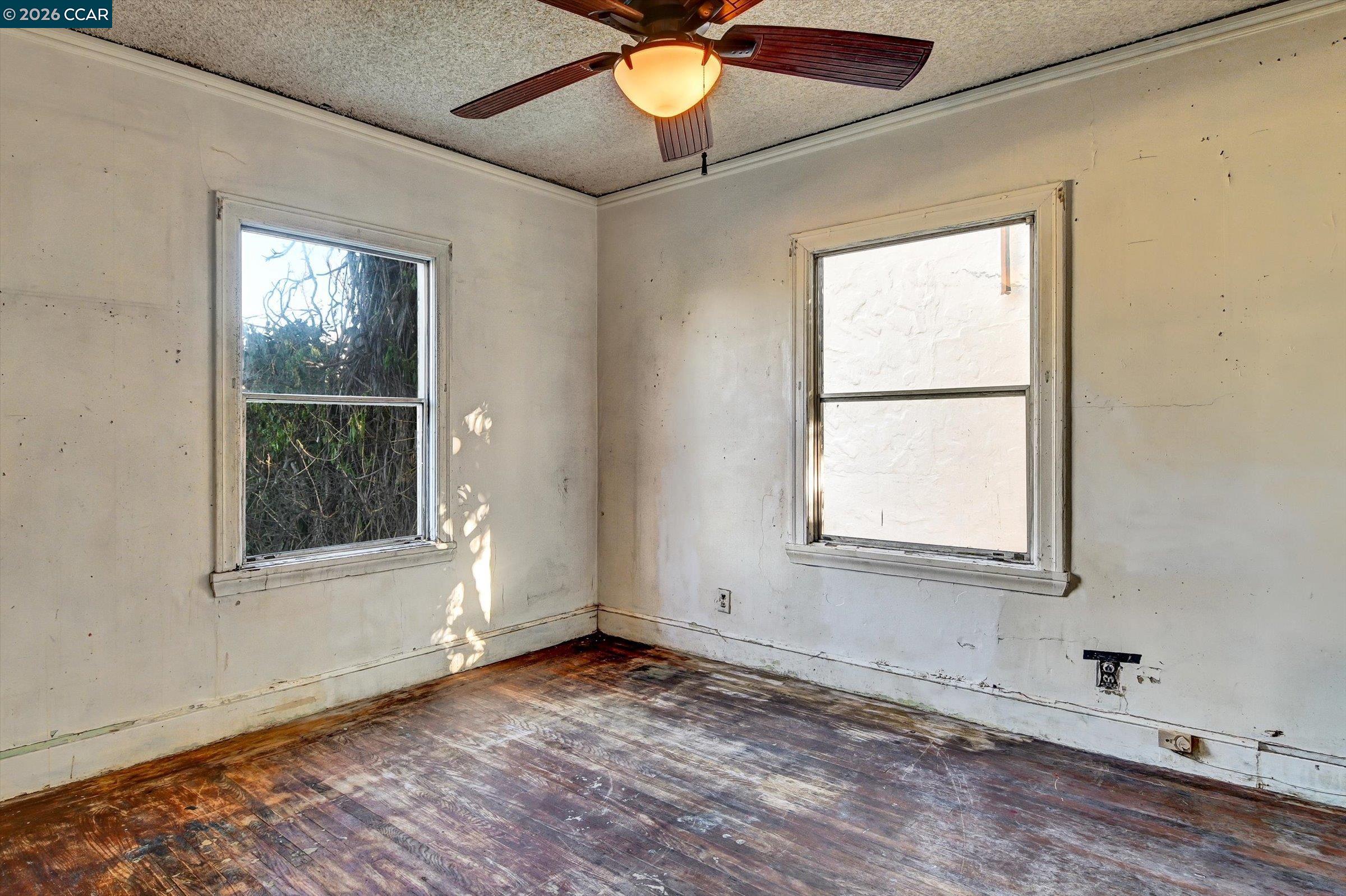 1711 Carleton Street Berkeley, CA 94703 - Photo 20 of 40 an empty room with wooden floor and windows