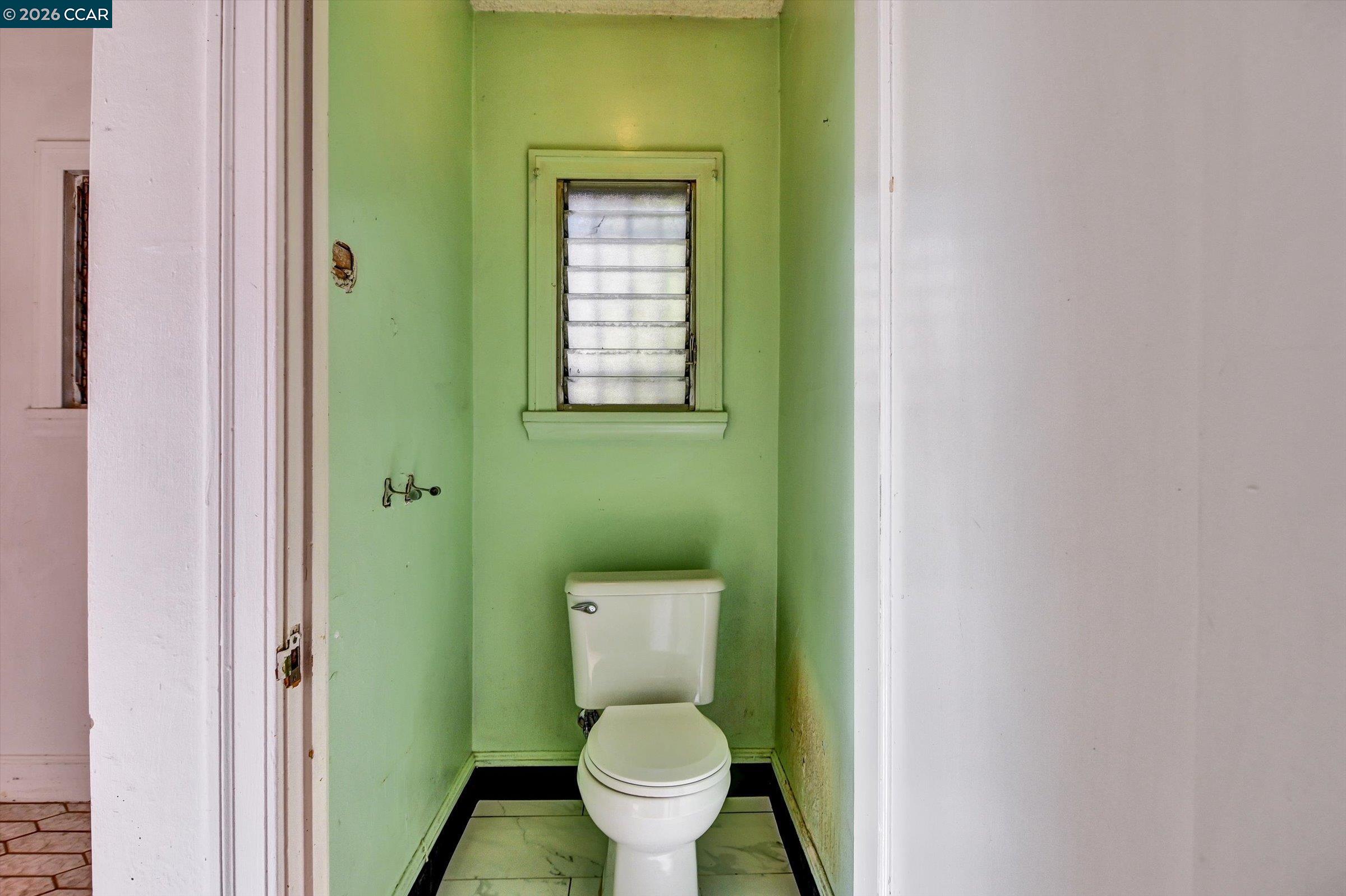 1711 Carleton Street Berkeley, CA 94703 - Photo 22 of 40 a bathroom with a toilet and a sink